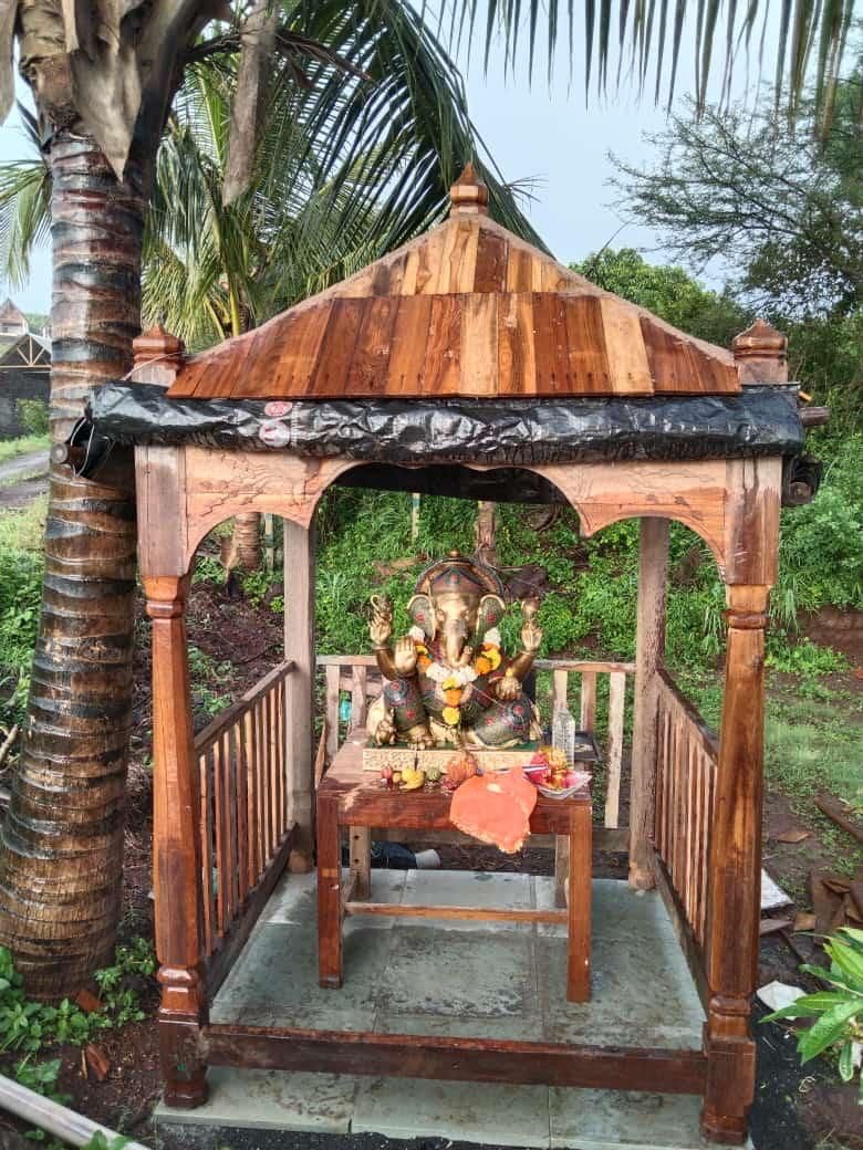Ganesh shrine in a wooden pavilion