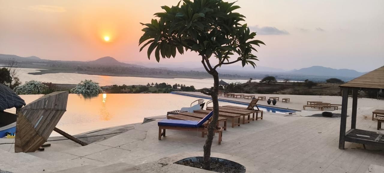Pool deck loungers at sunset